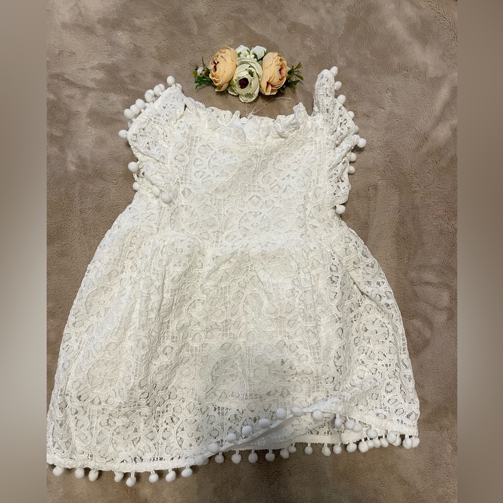 White Lace Dress with Pom Pom Trim and floral crown